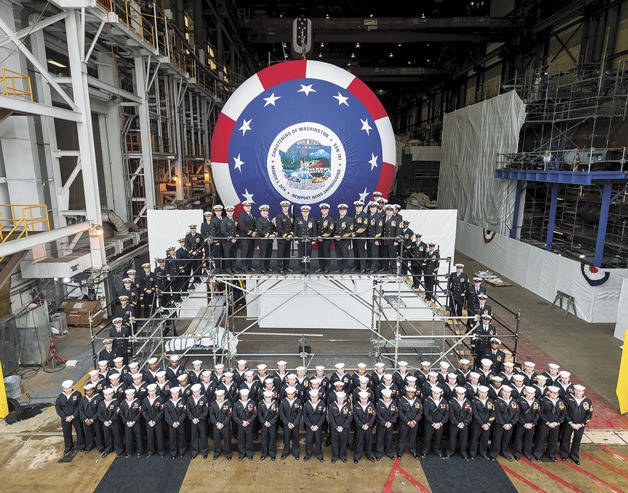 Special guests and sailors pose at the christening of the USS Washington in January. The sub will be based in Hawaii.