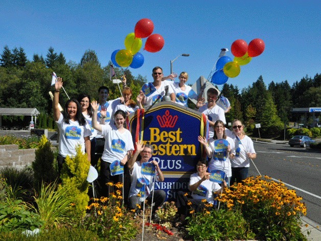 The award-winning staff of the Best Western Plus Bainbridge Island Suites gathers for a photo in front of the hotel on High School Road.