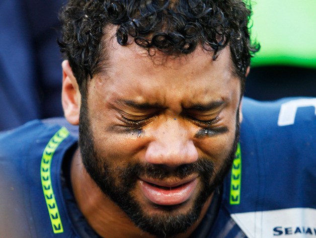 Seahawks quarterback Russell Wilson is overcome with emotion after coming back from a 16-point deficit to win the NFC Championship game against Green Bay