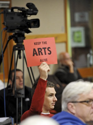 Citizens protested city budget cuts to the arts and humanities sector.