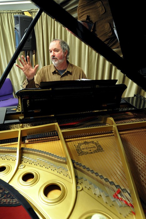 Island Music Center Executive Director Dave Bristow practices in preparation for this weekend’s Piano-a-thon.