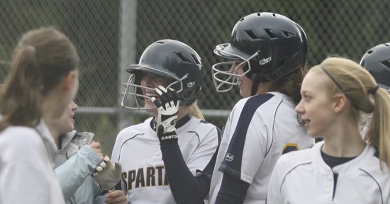 Cali Moore celebrates with teammates after hitting a grand slam in Tuesday’s win over West Seattle.