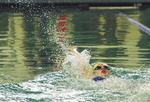 Ani Duni finishes the second leg in the girls 200-yard medley relay for the Spartans’ winning relay team during the triple dual meet Wednesday at the Bainbridge Aquatics Center.