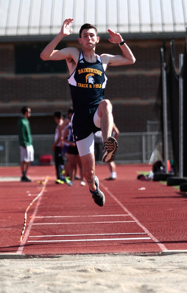 Brandon Swindle mid-air in the long jump event at last week’s the Spartans' home track meet.