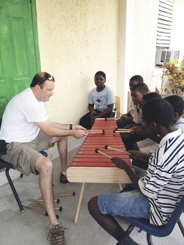 Island teacher Paul Meehan teaches Bahamian students to play the marimba.