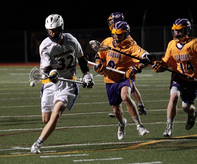 Michael Rose rushes to regain control of the ball during Friday's home game against Issaquah.