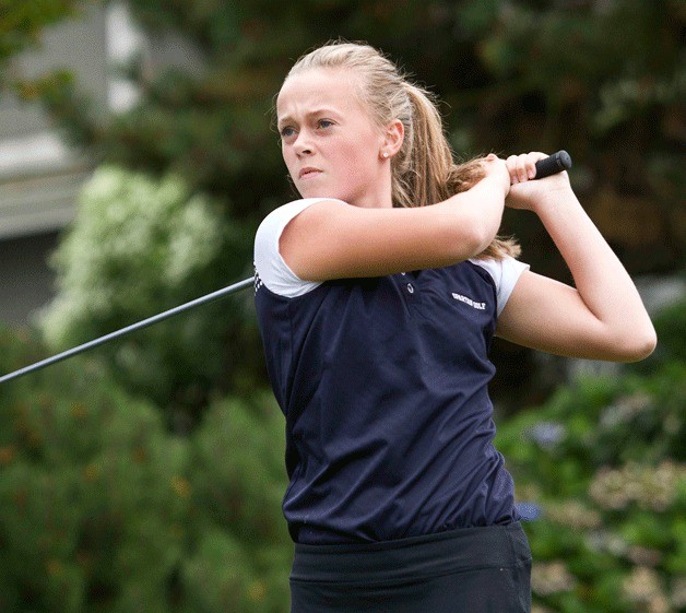 Taylor Tye of the Bainbridge Spartans golf team watches her shot fly during the matchup against Holy Names.