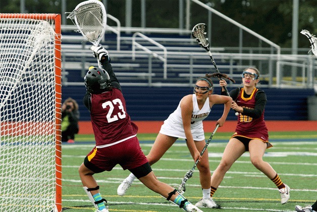 Sonia Olson fires a shot at the Lakeside goal during early action in the Spartans’ playoff game against the Lions.
