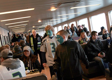 Seahawks fans pack the Bainbridge Island ferry to Seattle Wednesday morning.