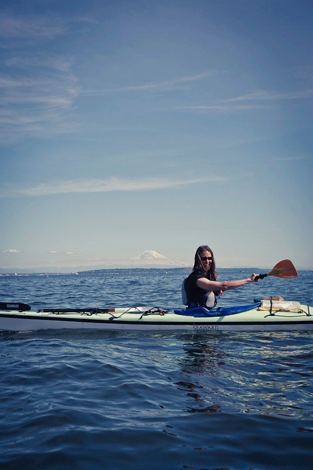 Spring Courtright cuts through the waters off Bainbridge Island with Mount Rainier in the background during an earlier Paddle Bainbridge event.