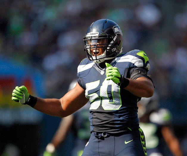 Seattle linebacker K.J. Wright celebrates a loss of yards in the second half.