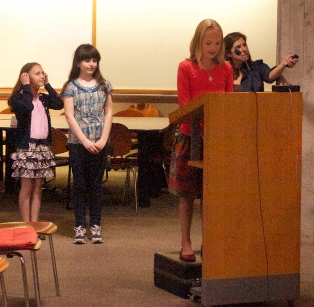 Eleanor Collins introduces her classmates and the concerns surrounding the Murden Cove watershed at Wednesday's city council meeting.