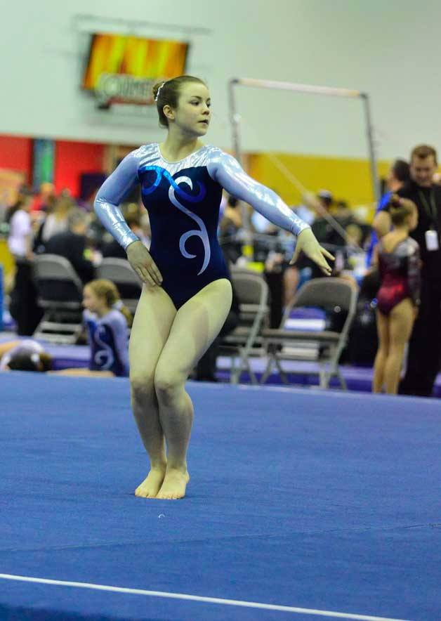 Angeleana Golden poses on floor during the competition.