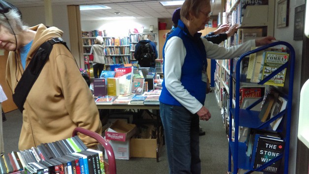 Islanders peruse the selections at a recent Friends of the Library book sale.