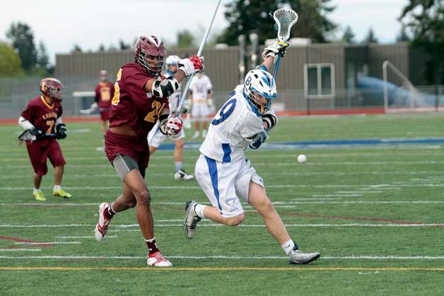 Max Oden looks to regain control of the ball during Friday’s Senior Night game against Lakeside.