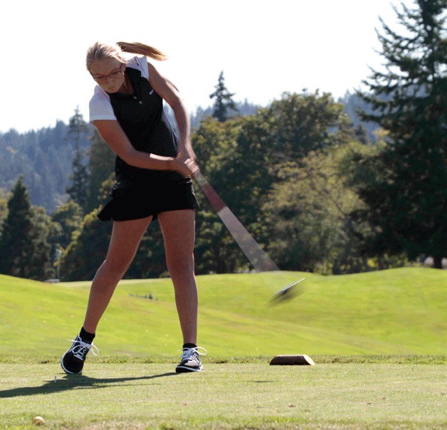 Spartan golfer Kiera Havill tees off at the first hole at Wing Point Golf Course during the team's season debut match against Eastside Catholic.