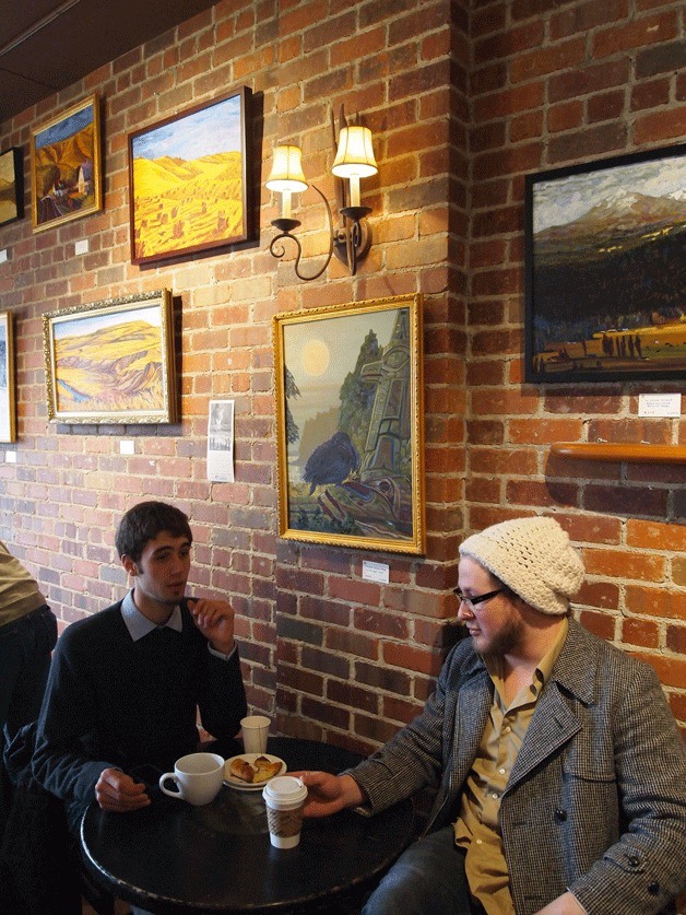 Hays' oil paintings adorn the walls above Bainbridge Bakery patrons. The scenic paintings will be up for view