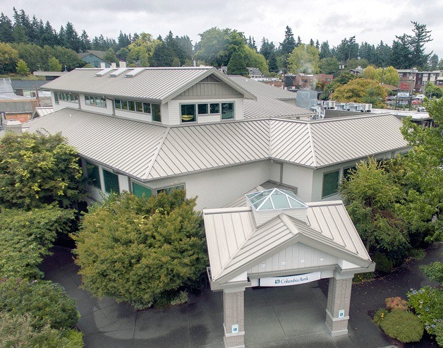 Local businessman George Lobisser bought the iconic American Marine Bank building from Columbia State Bank of Tacoma on Aug. 22. Columbia Bank will continue to lease its 4