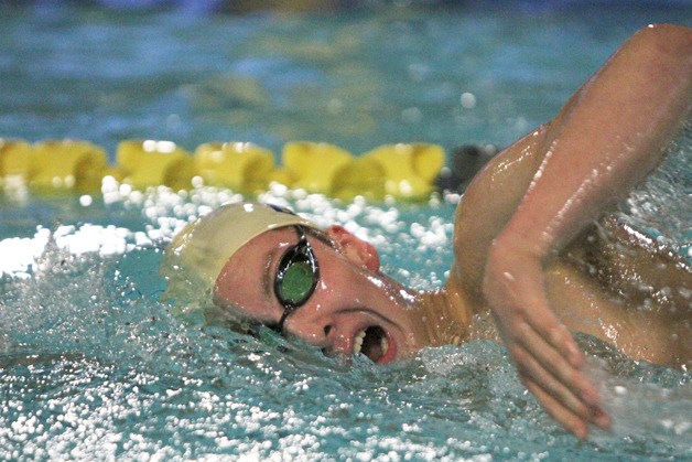Sam Chapman swims to third place in the 500-yard freestyle in the Spartans' last home meet against O’Dea.