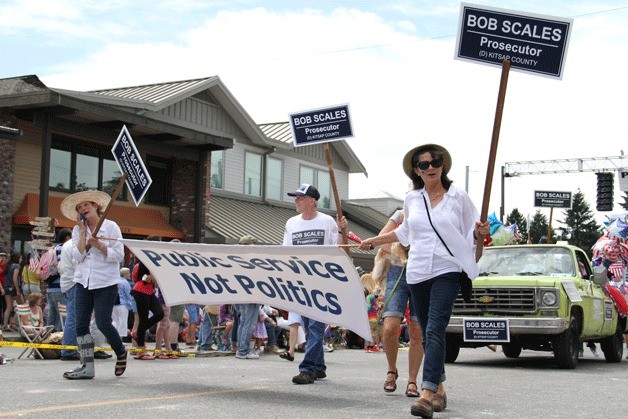 Supporters for Bob Scales for Kitsap County prosecutor march in the Fourth of July parade through downtown Winslow.