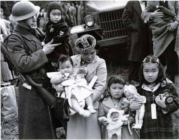 “Kitamoto family with soldier” from the Seattle Post Intelligencer collection at the Museum of History and Industry.