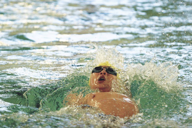 The Spartans’ Bill Lee swims to a second-place finish in the 200-yard individual medley during Friday’s meet against O’Dea. He finished with a district-qualifying time of 2:12.26. Teammate Marcus Tonsmann was first in 2:10.91.