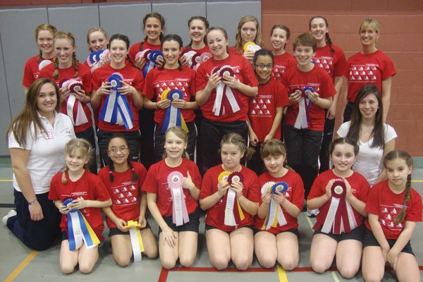 The Bainbridge Island Rope Skippers pose with their ribbons after the Bainbridge Island Invitational Rope Skipping Tournament. (L-R) Front row (kneeling): the Junior Team: Reilly Woods
