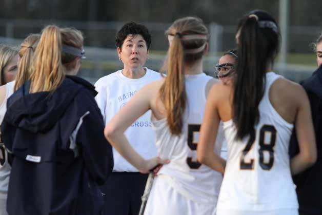 Spartan Head Coach Tami Tommila talks to her team during halftime at a recent home game.