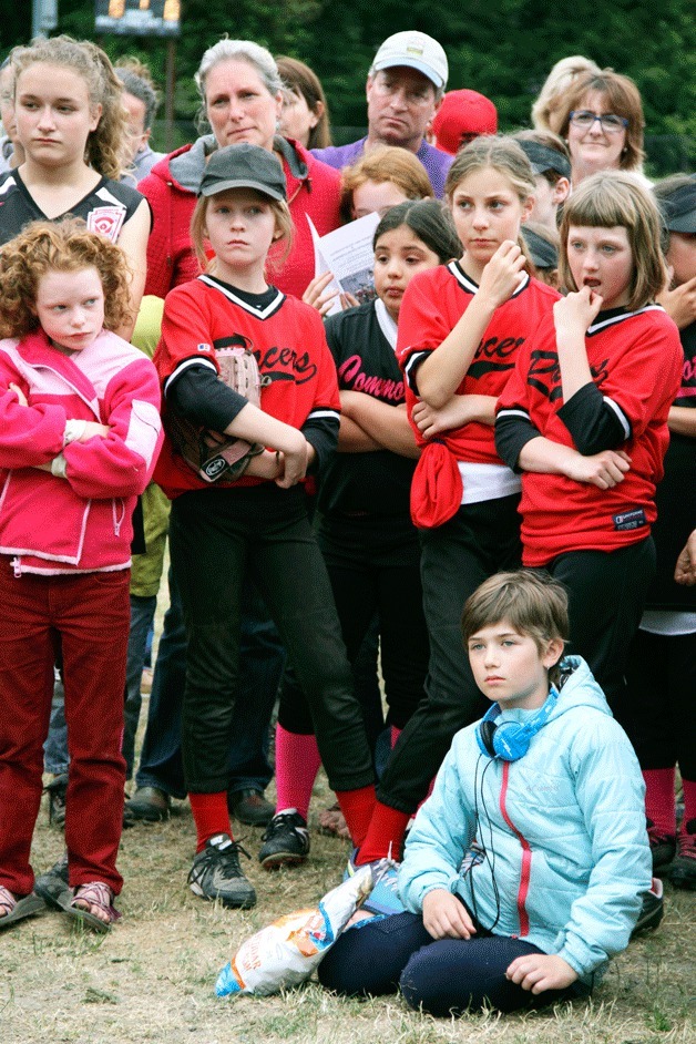Softball players from the Racers listen as officials rename Field 3 at Strawberry Hill Park after Kurt Lindsay