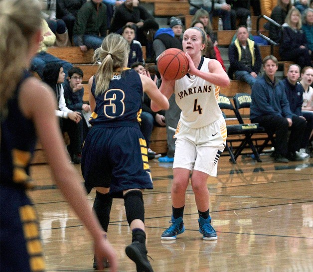 BHS junior guard Taylor Tye lines up a three-pointer during Friday’s home game against West Seattle.