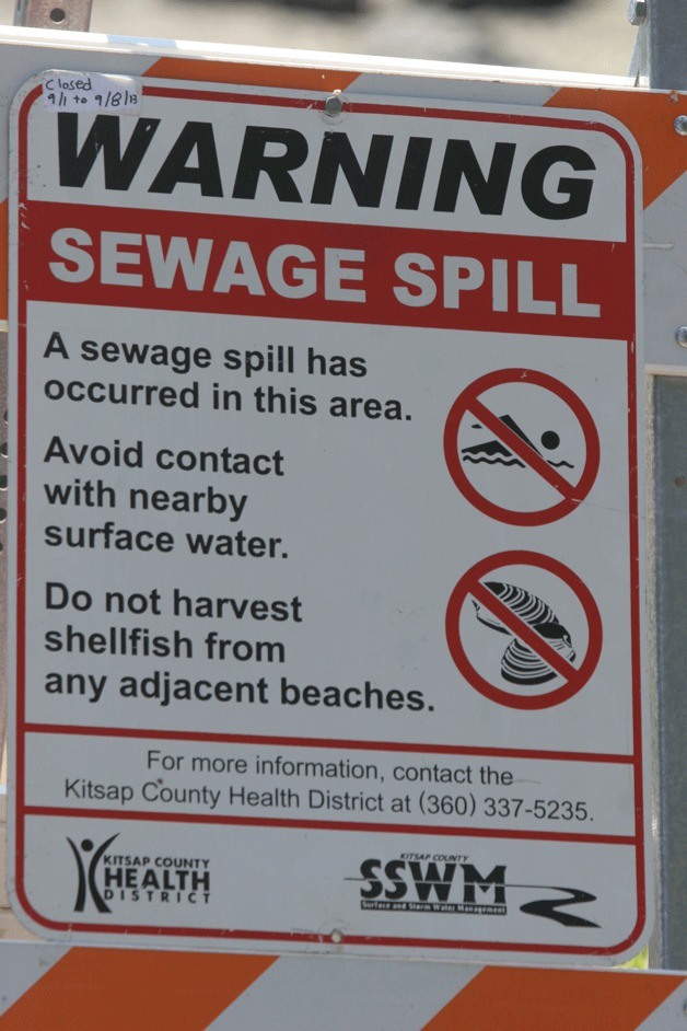 The city is advising that human and pets should avoid contact with water in Eagle Harbor after Friday's sewage spill until warning signs have been removed from beaches.