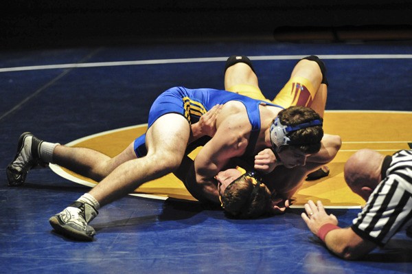 Senior Connor Kenyon (top) pinned his 182-pound Kingston opponent last week.