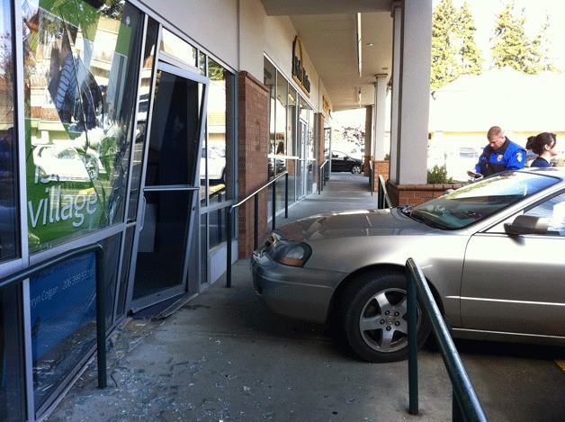 A sedan crashed into the front of a vacant business in the Island Village Shopping Center Wednesday. No one was hurt in the crash.