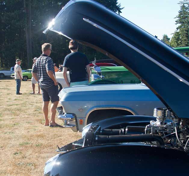 Cars sit on display at Tuesday’s Classic Car Cruise-In at the corner of Highway 305 and Madison Avenue. The island tradition has gathered car lovers for more than a decade in support of Helpline