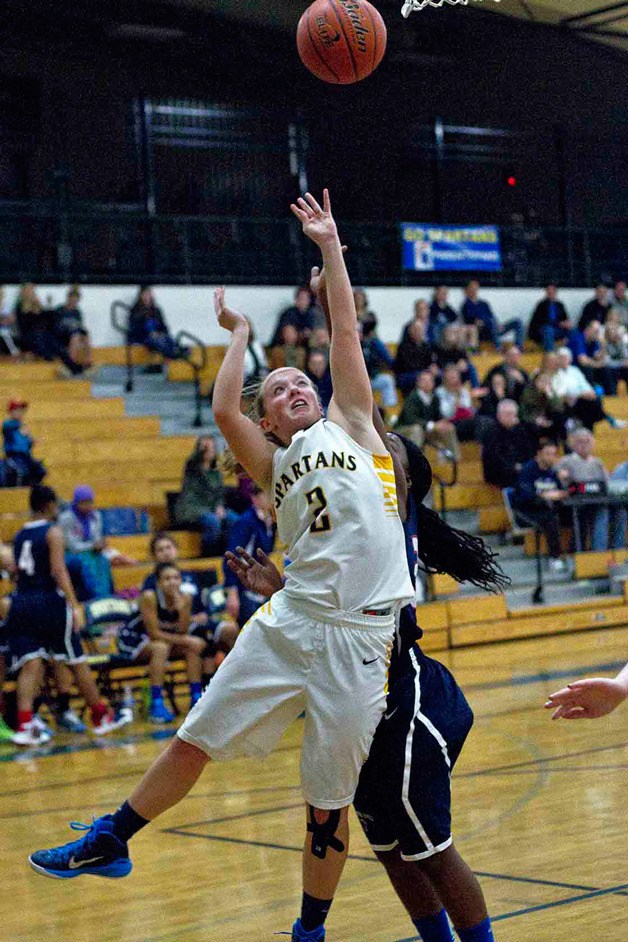 BHS senior guard Paige Brigham tries for a layup during Wednesday's home game against Nathan Hale. The Spartans easily outplayed the visitors