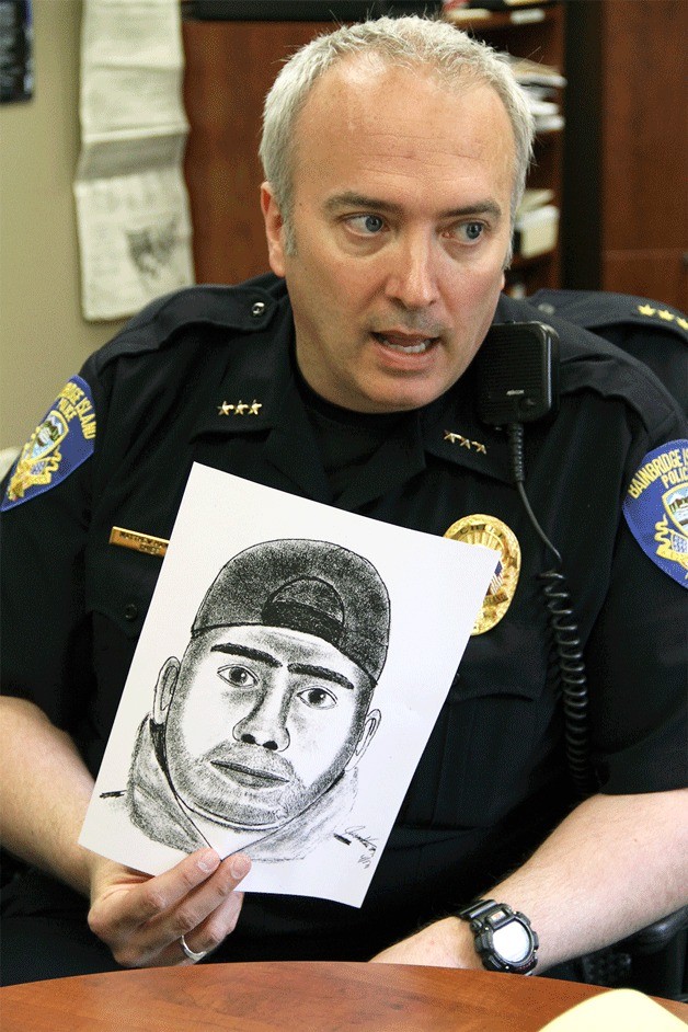 Bainbridge Police Chief Matthew Hamner holds a police sketch of a suspected serial burglar during a press conference Wednesday.