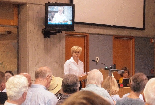 Islander Laura Peterson spoke to the council about her objections to the term 'nonconforming' being applied to many shoreline homes.