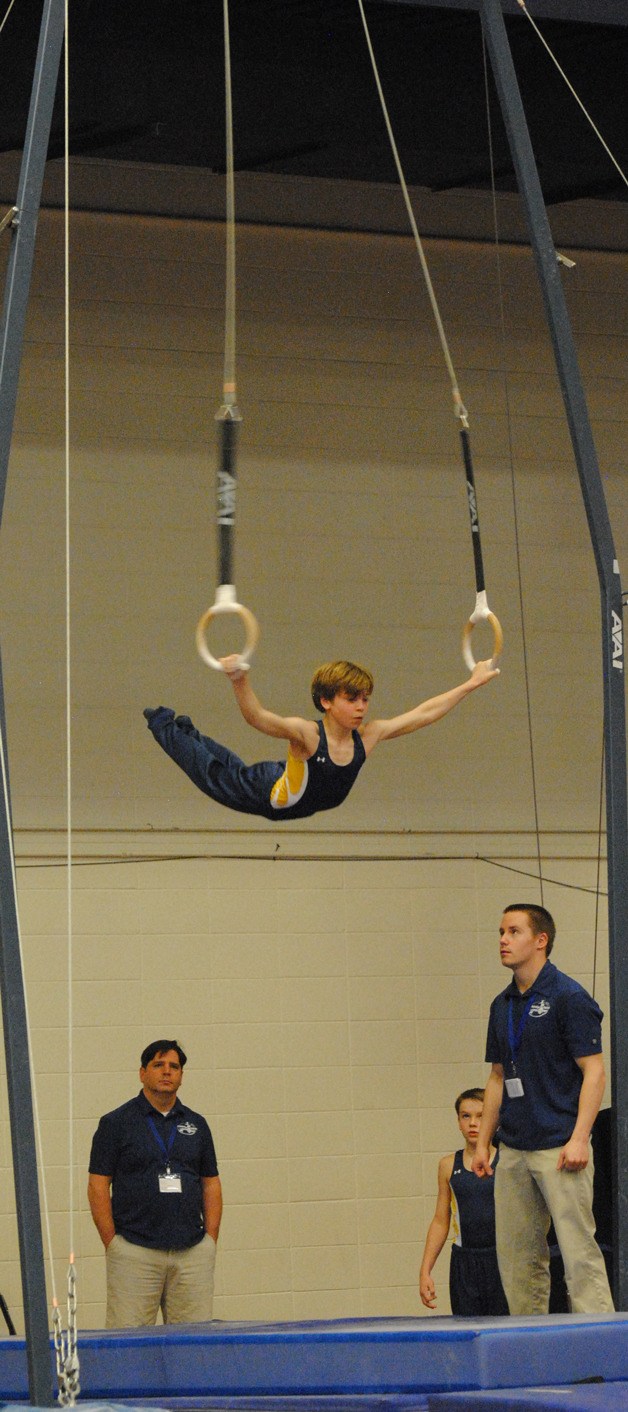 Jacob Hall competes on rings at the Region 2 Men’s USA Gymnastics Championships.