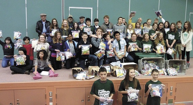 Students at Woodward Middle School show the Kits for Kids they helped gather for the Continuum of Care Coalition’s Project Connect.
