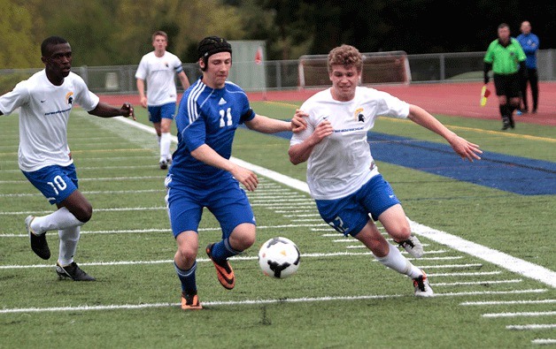 BHS senior Tanner Salmon races toward the ball to gain back possession during Tuesday's game against Stadium High.