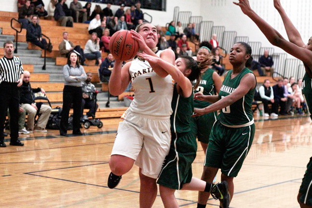 Katie Usellis is fouled on a drive to the basket during Metro League action against Franklin.