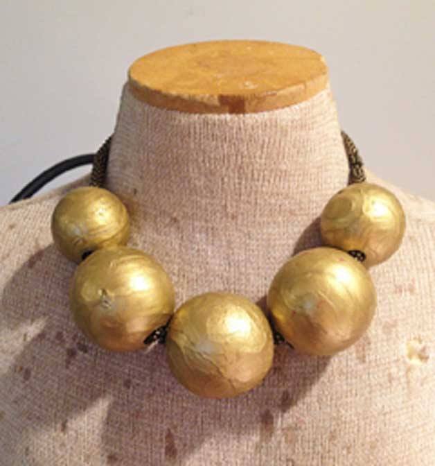 Necklace by Sharon Rosenthal (painted wood and brass).
