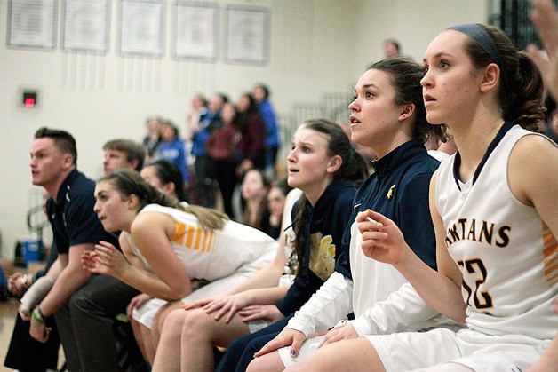 The Spartan bench watches in rapt anticipation as Paige Brigham attempts the free throw that tied the game 44-all with less than .5 seconds to go.