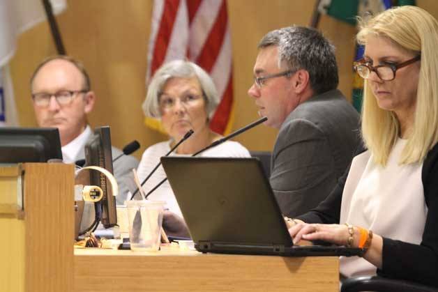 Bainbridge City Manager Doug Schulze (second from right) briefs the city council on the site selection process for a new location for the Bainbridge Island Police Department at the council's Tuesday meeting.