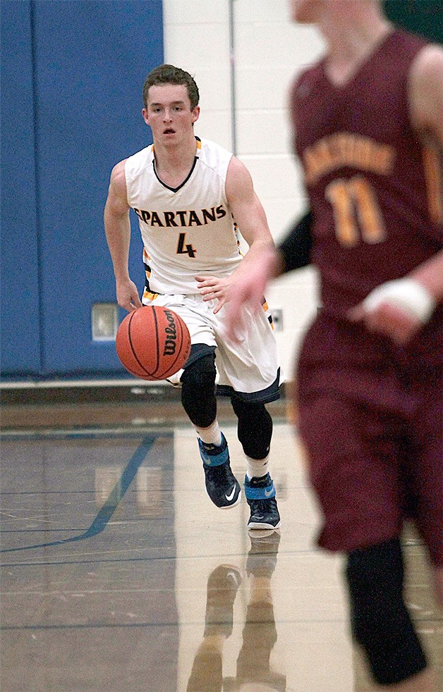 BHS senior guard Blake Swanson drives the ball down the court early in Tuesday’s home game against the Lakeside Lions.