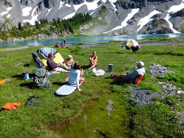 Members of the Peninsula Wilderness Club relax during a camping trip.
