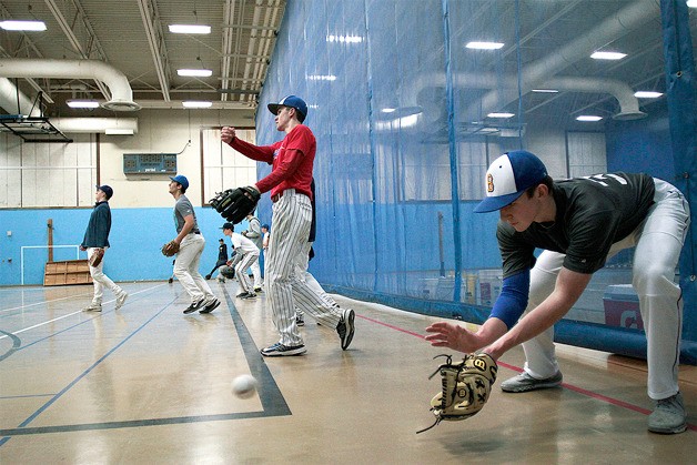 The Bainbridge High School varsity baseball team practices indoors during early season rains last week. Denied the use of the field