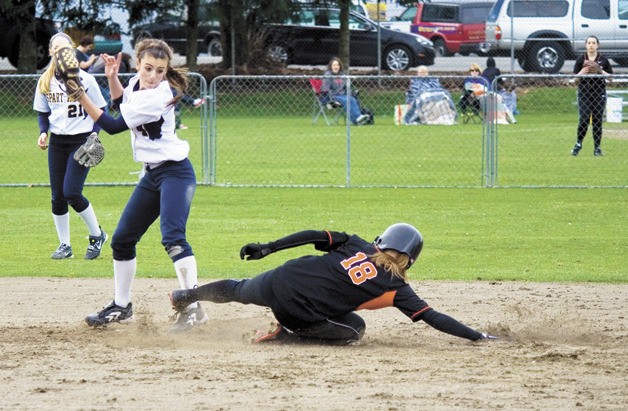 Central Kitsap shortstop Samantha Williams slides into second base during the Cougars’ opening game