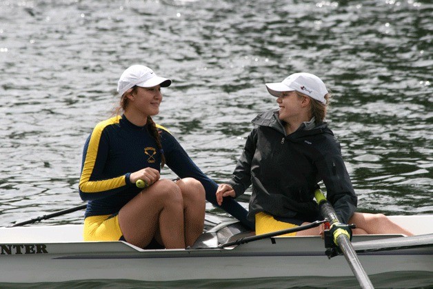 Bainbridge Varsity Girls Elisabeth Chun and Kate Hathaway share a smile after winning the Lysen Cup in the Opening Day/Windermere Regatta with teammates Liz Fawley