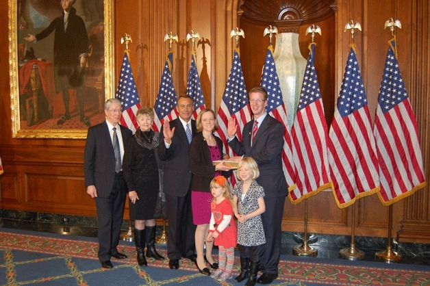 U.S. Rep. Derek Kilmer stands with his family — wife Jennifer
